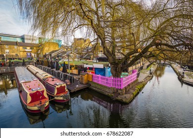 London, England - The world famous Camden Lock Market with mooring houseboats and tree - Powered by Shutterstock