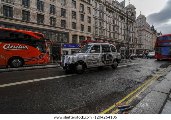 London,\
England/United Kingdom-SEPT. 2018, LONDON city view ,traditional\
British style buildings with cars in the\
road.