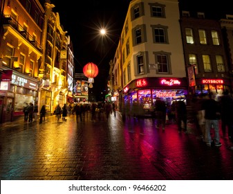 LONDON- FEB 13: Tourists In London's Famous Chinatown And Soho At Night. Chinatown, London, Feb 13, 2012.