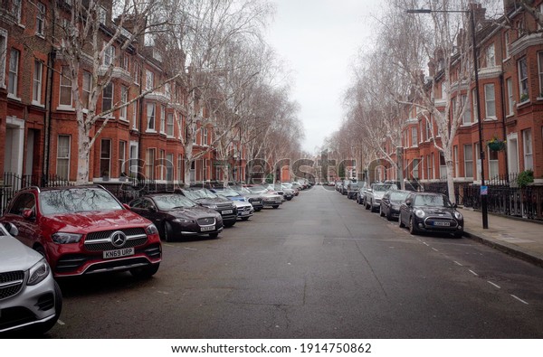 London-\
February, 2021: Expensive cars parked on upmarket street in Maida\
Vale area of Paddington, North West\
London