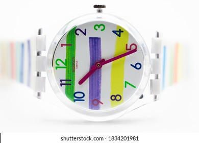 London, GB 07.10.2020 - Swatch children's swiss made quartz watch isolated on white background. transparent plastic case youth hipster style watch for bright image. Children's marker drawing in design