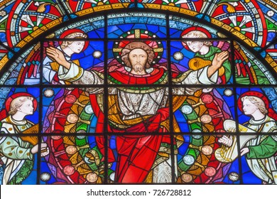 LONDON, GREAT BRITAIN - SEPTEMBER 14, 2017: The resurrected Jesus Christ among the angels on the stained glass in the church St. Michael Cornhill by Clayton and Bell from 19. cent.