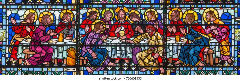 LONDON, GREAT BRITAIN - SEPTEMBER 16, 2017: The stained glass of Last Supper in church St Etheldreda by Joseph Edward Nuttgens (1952).