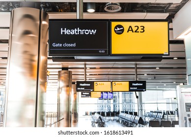 London, Heathrow Airport, Aug 2019: Yellow Illuminated Signs At Airport With Gate Number. Gate Closed