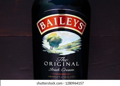 LONDON - JANUARY 08, 2019: Baileys Irish Cream Glass Bottle On Dark Wood Background