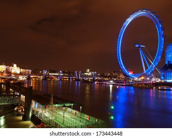 LONDON - JANUARY 19: Night Shot Of The London Eye On January 19, 2014 In London. The London Eye Is A  Ferris Wheel Situated On The Banks Of  River Thames. The  Structure Is 135 M Tall.                