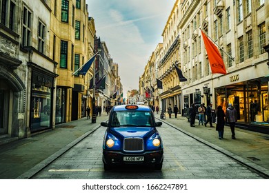 LONDON- JANUARY, 2020:  A London Taxi Cab On Bond Street, An Upmarket West End Street Famous For Its Designer And Luxury Shops