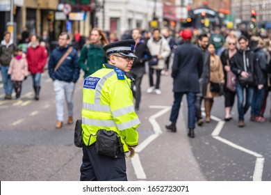 London, January 26, 2020. British Police Officer Patrolling The Streets Of England Wearing Stab Vest.