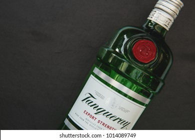 LONDON - JANUARY 30, 2018: Tanqueray Gin In Glass Bottle With Logo On Dark Background