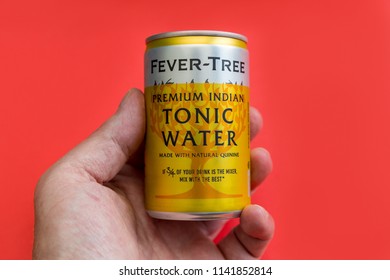 LONDON - July 18, 2018: Fever Tree Tonic Water Cans On Red Background