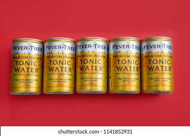 LONDON - July 18, 2018: Fever Tree Tonic Water Cans On Red Background