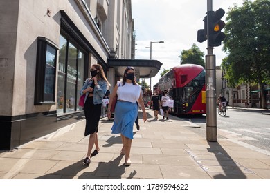 LONDON -JULY, 2020: Female Shoppers On Kensington High Street Wearing Covid 19 Masks