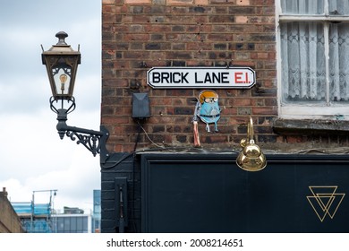 London- July, 2021: Brick Lane Street Sign, A Landmark Street In East London Notable For Its Bengali Population And Hipster Shops And Markets