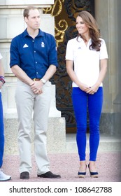 LONDON - JULY 26:  Kate Middleton, Prince William And Prince Harry Are Seen Outside Buckingham Palace Waving To Crowds, July 26, 2012 In London, Uk