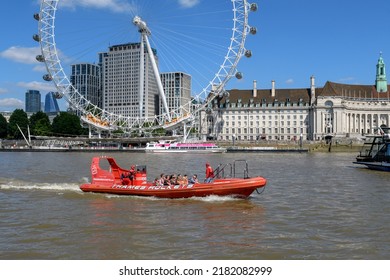 London - July 7, 2022: An Thames Rocket Boat Carries Passengers On The River Thames In Front Of The London Eye.