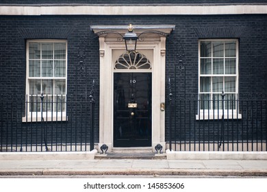 LONDON - JUN 16: Entrance door of 10 Downing Street in London on June 16, 2013. The street was built in the 1680s by Sir George Downing  and is now the residence of the Prime Minister.