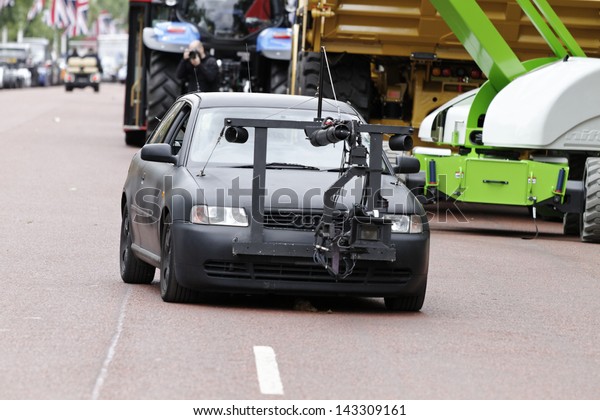 LONDON - JUN 23 : Car with front video recording\
movie camera at the \