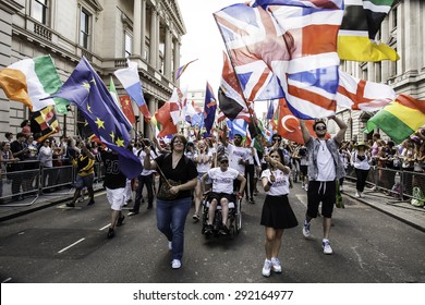 LONDON - JUN 27: The flag-bearers lead the march at the Gay Pride parade on June 27th, 2015, in London cheering the parade, London UK