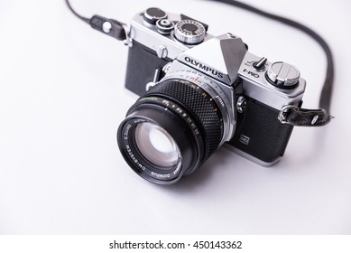 LONDON - JUNE 10, 2016 : Olympus OM-1 35mm  Film Camera with 100MM 2.8 lens Photography Gear in Bright Studio.
For Illustrative Editorial image
