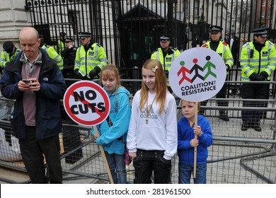 LONDON - MAR 26: An Unidentified Family Protests Outside Downing Street During An Anti Austerity Rally On Mar 26, 2011 In London, UK.