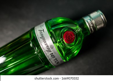 LONDON - MARCH 03, 2020: Tanqueray Ten Gin In Green Glass Bottle On Dark Black Background