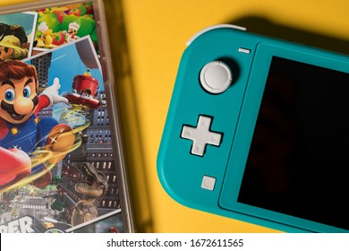 LONDON - MARCH 12, 2020: Nintendo Switch Lite Handheld Video Game Console