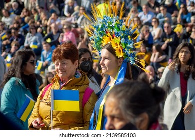 LONDON - March 26 2022: A Woman Wears A Traditional Vinok (flower Crown) In Blue And Yellow While Holding A Flag At The Vigil Held In Solidarity For Ukraine, Attended By Thousands In Trafalgar Square