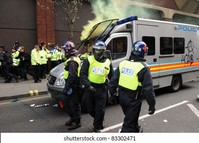 LONDON - MARCH 26: Riot Police Come Under Attack During A Large Anti-cuts Rally On March 26, 2011 In London, UK.