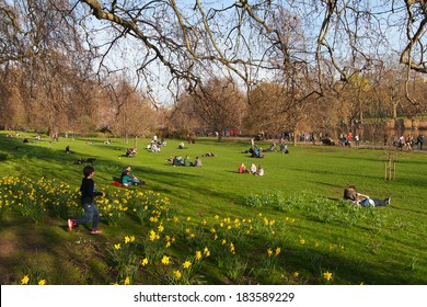 LONDON - MARCH 8: Londoners bask in first spring sun in St James Park, London on 8th March 2014.