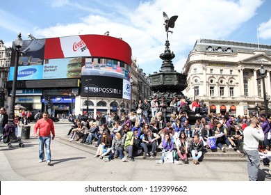 LONDON - MAY 13: People visit Piccadilly Circus on May 13, 2012 in London. With more than 14 million international arrivals in 2009, London is the most visited city in the world (Euromonitor).