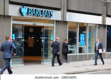 A Young Female Customer Entering Barclays Bank St David S Way
