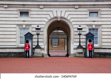 LONDON - MAY 17: British Royal guards guard the entrance to Buckingham Palace on May 17, 2013 in London, UK