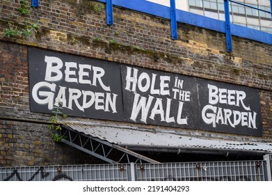 LONDON - May 20, 2022: Beer Garden Sign On Old Brick Wall