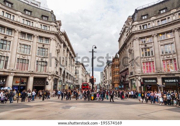 LONDON - MAY 20: Oxford Circus with unidentified
people on May 20, 2014 in London. Up to over 40.000 pedestrians per
hour pass the junction, it is the highest pedestrian volumes
recorded in London.