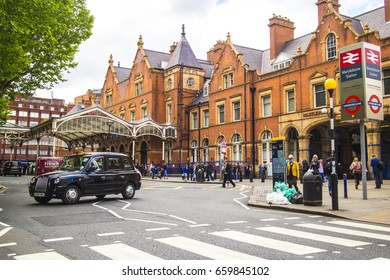 LONDON- MAY 2017: Marylebone Station Exterior With Black London Taxi Driving Off With Passengers.