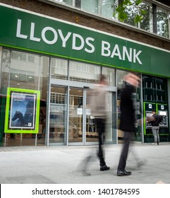 LONDON- MAY, 2019: Lloyds Bank Exterior With Motion Blurred People. A British High Street Retail And Commercial Bank. 