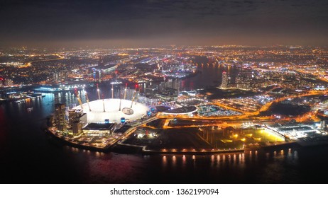 London, North Greenwich / United Kingdom: March 18 2019: Aerial night shot from iconic O2 Arena in Greenwich Peninsula