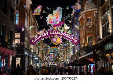 LONDON - NOVEMBER 1, 2021: A Busy Carnaby Street With The Colourful Christmas Decorations Suspended Above