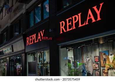 LONDON - NOVEMBER 1, 2021: Illuminated Shop Sign And Shop Front On Carnaby Street At Night