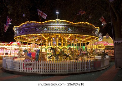 London - November 28 2014: Night scene of Hyde Park's winter wonderland. Fairgrounds stall at the Winter Wonderland event in Hyde Park London