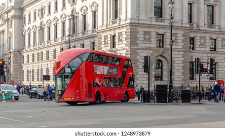 London, Oct 24, 2018 - New Routemaster Bus Turning Corner On London Street.