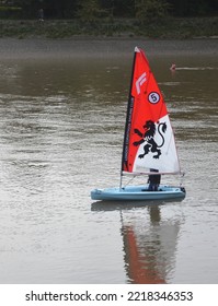 LONDON - OCTOBER 16, 2022. A Small London Corinthian Sailing Club Yacht Sails The River Thames At Fulham Reach In West London, UK.