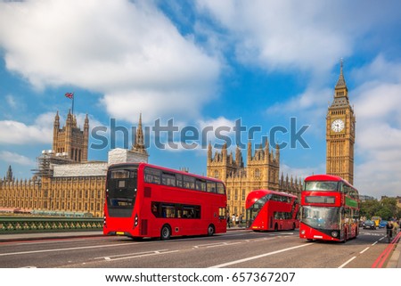  London with red buses against Big Ben in England, UK
