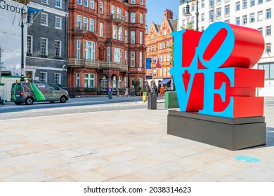 LONDON - SEPTEMBER 07, 2021: Letters "Love" on the pavement on Berkeley Square, a high end landmark area with shops and businesses in London's West End