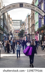 LONDON- SEPTEMBER, 2018: Crowds Of People Walking Down Busy Carnaby Street In Soho,  Famous For Its Many Fashion Stores