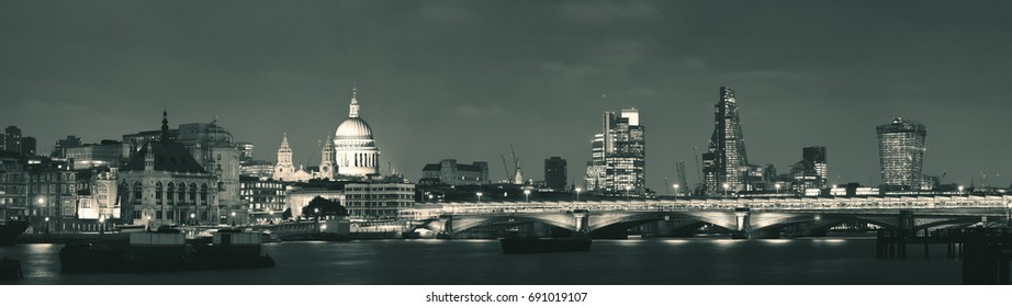 London Skyline At Night With Bridge And St Pauls Cathedral Over Thames River.