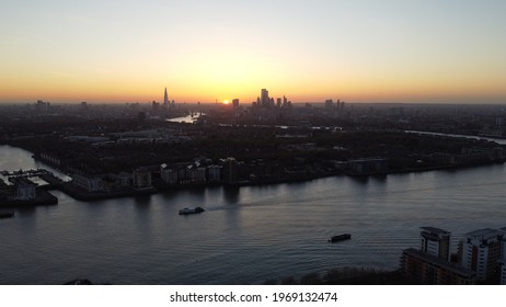 London Skyline And River Thames Clipper At Sunset