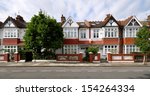 London street of early 20th century Edwardian terraced houses, without parked cars.