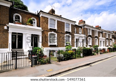 London street of typical small 19th century Victorian terraced houses, without parked cars