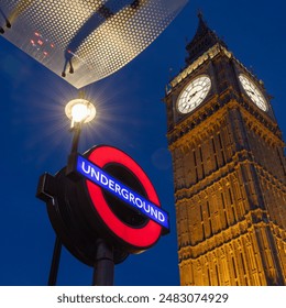 London Tourism, Big Ben and London Underground sign for Westminster Station. Looking up at the sky with iconic London landmarks. European capital city tourism and background.  - Powered by Shutterstock